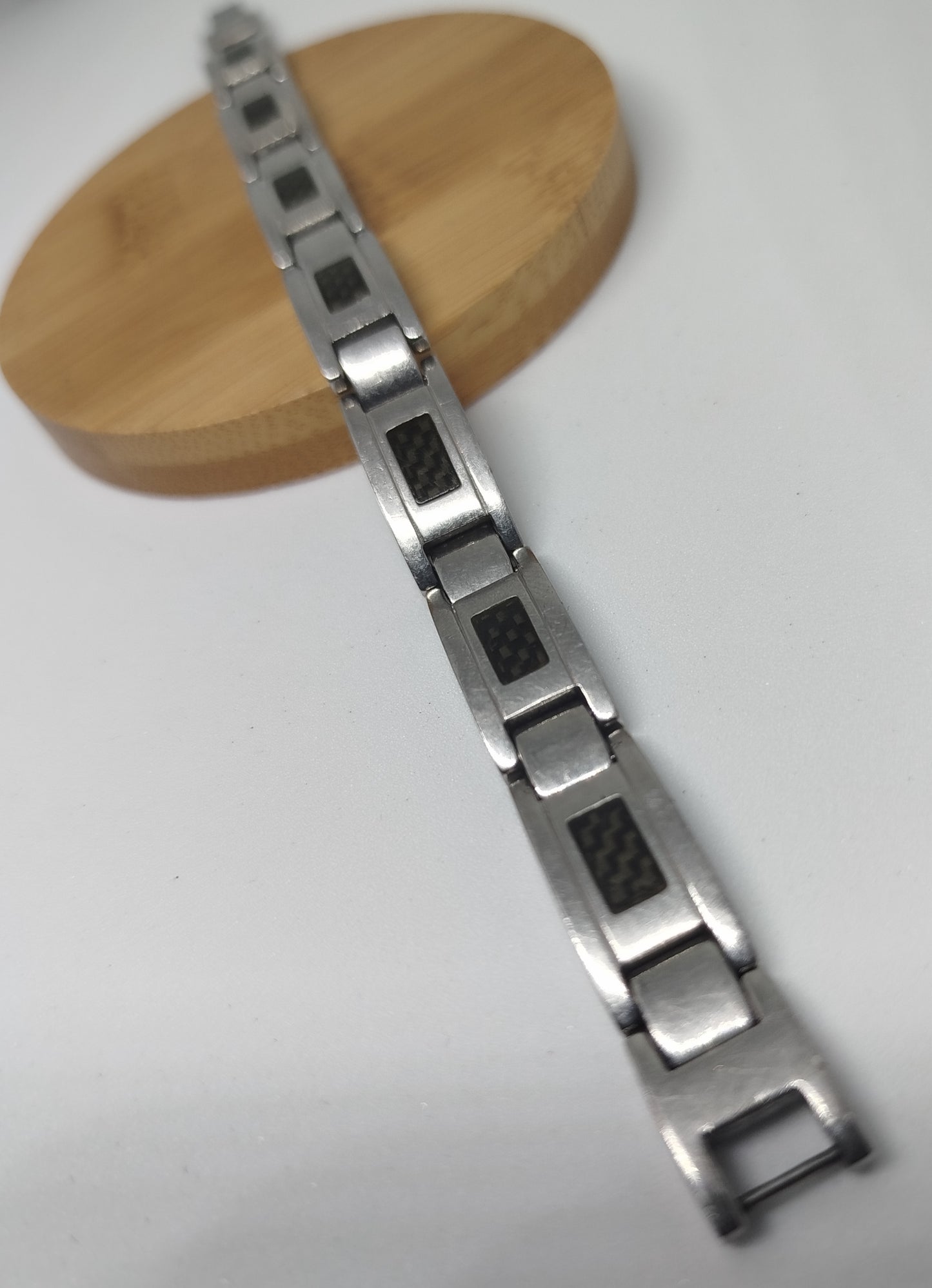 Gourmette seconde main noir motif fibre de carbone et acier inoxydable | Design and Company