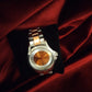 Montre femme de seconde main orange et silver .