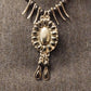 Collier fantaisie griffe et ovalie
